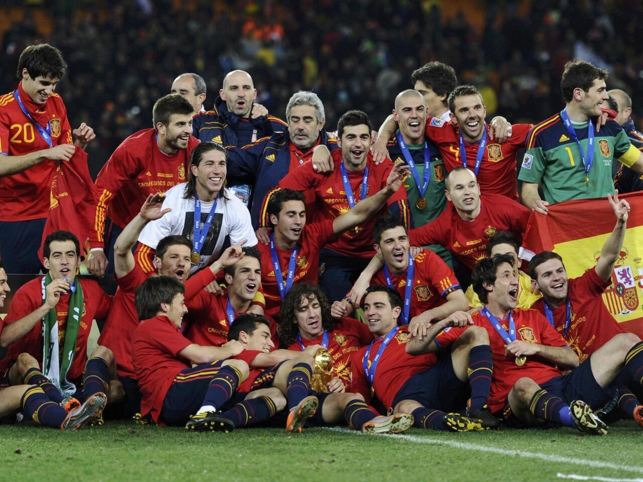 Spain players celebrate after the 2010 World Cup final soccer match between Netherlands and Spain at Soccer City stadium in Johannesburg
